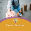 Adult and child holding hands outdoors, viewed from above, with the text “Positive Discipline” and a small heart icon overlaid on a curved banner.